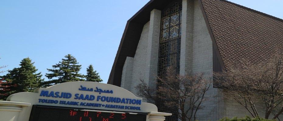 The Masjid Saad Foundation sign, reading Toledo Islamic Academy and Albayan School, in front of the A-frame building on Alexis Road